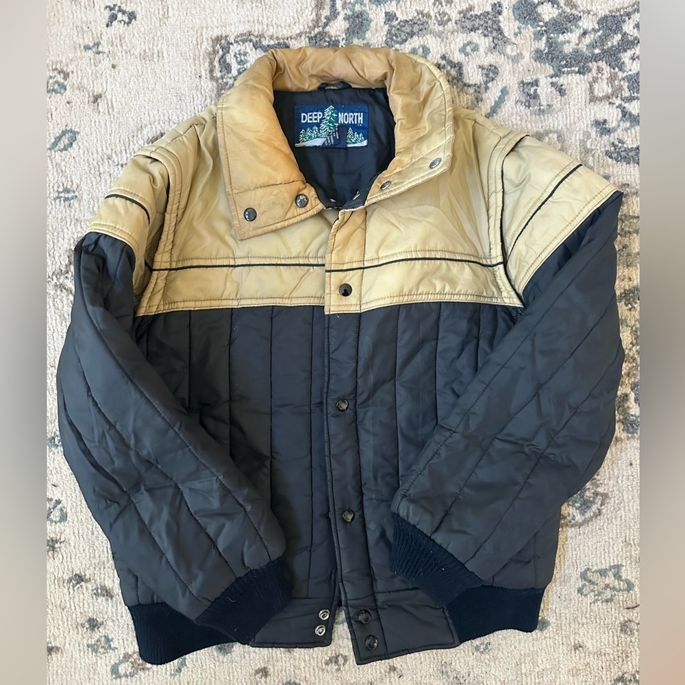 Deep North black and tan puffer jacket
Sleeves unzip into vest